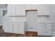 White kitchen cabinets featuring a subway tile backsplash and plenty of countertop space at 908 Westminster Dr, Statesville, NC 28677