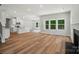 Open-concept living space featuring a fireplace and a kitchen island, great for entertaining at 908 Westminster Dr, Statesville, NC 28677