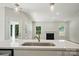 View of a living room fireplace and access to backyard from the kitchen island at 908 Westminster Dr, Statesville, NC 28677
