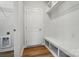 Mudroom features a bench with storage and hooks for added organization at 908 Westminster Dr, Statesville, NC 28677