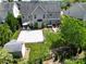 Wide backyard featuring sport court, patio area, shed and garden beds, ideal for outdoor recreation at 9612 Indian Beech Nw Ave # 1266, Concord, NC 28027