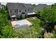 Spacious backyard featuring a sports court, patio with seating, and lush green lawn at 9612 Indian Beech Nw Ave # 1266, Concord, NC 28027
