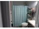 Cozy bathroom with a decorative shower curtain and neutral colors at 9612 Indian Beech Nw Ave # 1266, Concord, NC 28027
