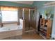 Elegant bathroom features a luxurious soaking tub and walk-in shower, perfect for relaxation at 9612 Indian Beech Nw Ave # 1266, Concord, NC 28027