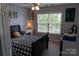 Comfortable bedroom featuring modern decor and a bright window view, creating an inviting space at 9612 Indian Beech Nw Ave # 1266, Concord, NC 28027