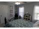 Inviting bedroom features calming decor and a cozy atmosphere enhanced by natural lighting at 9612 Indian Beech Nw Ave # 1266, Concord, NC 28027