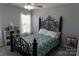 Charming bedroom with a decorative metal frame bed, complemented by soft natural light at 9612 Indian Beech Nw Ave # 1266, Concord, NC 28027