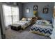 Inviting bedroom with two twin beds, neutral decor, and bright natural light at 9612 Indian Beech Nw Ave # 1266, Concord, NC 28027