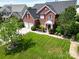 Stunning brick home with a well-maintained lawn and manicured landscaping at 9612 Indian Beech Nw Ave # 1266, Concord, NC 28027