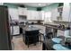 Beautiful kitchen with stainless steel appliances, mosaic backsplash, white cabinetry, and an island at 9612 Indian Beech Nw Ave # 1266, Concord, NC 28027