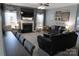 Spacious living room with cozy fireplace, neutral walls, and comfortable seating arrangement at 9612 Indian Beech Nw Ave # 1266, Concord, NC 28027