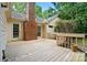 Wood deck with views of the yard, brick chimney and siding at 9927 Raddington Ln, Charlotte, NC 28269