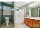 Bathroom featuring white tiled shower/tub and vanity at 9927 Raddington Ln, Charlotte, NC 28269