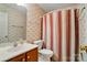 Cozy bathroom featuring a single sink vanity and shower-tub combination at 9927 Raddington Ln, Charlotte, NC 28269