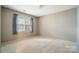 Standard bedroom with carpet flooring and natural light from windows at 9927 Raddington Ln, Charlotte, NC 28269