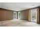 Cozy bedroom features carpet flooring and natural light from windows at 9927 Raddington Ln, Charlotte, NC 28269