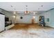Spacious two-car garage with ample storage space and access to the rest of the home at 9927 Raddington Ln, Charlotte, NC 28269