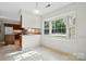 Bright eat-in kitchen features a bay window and breakfast bar at 9927 Raddington Ln, Charlotte, NC 28269