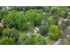 Beautiful aerial view of a property nestled among lush green trees in a peaceful, residential neighborhood at 1014 Vandalia Dr, Charlotte, NC 28212
