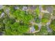 This aerial view showcases the home's setting in a tree-filled neighborhood on a quiet street at 1014 Vandalia Dr, Charlotte, NC 28212