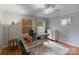 Bright home office featuring two desks, hardwood floors, a ceiling fan, and light gray walls at 1014 Vandalia Dr, Charlotte, NC 28212