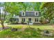 Charming two-story home with landscaped yard, mature trees, and a welcoming front porch at 1014 Vandalia Dr, Charlotte, NC 28212