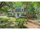 Two-story home with a well-manicured lawn, mature trees, and inviting curb appeal at 1014 Vandalia Dr, Charlotte, NC 28212