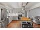 Modern kitchen featuring stainless steel appliances, white cabinets, and an island at 1014 Vandalia Dr, Charlotte, NC 28212