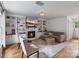 Comfortable living room with a fireplace, built-in shelving, and hardwood floors at 1014 Vandalia Dr, Charlotte, NC 28212