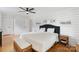 Bright primary bedroom with shiplap accent wall and stylish decor elements at 1014 Vandalia Dr, Charlotte, NC 28212