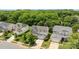 Aerial view of a charming home with a well-kept lawn, mature trees, and a welcoming two-car garage at 10418 Cullen Ct, Charlotte, NC 28278