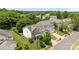 Aerial view of a beautiful home showcasing its manicured lawn, two-car garage, and established landscaping at 10418 Cullen Ct, Charlotte, NC 28278
