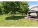 A spacious backyard featuring a cozy gazebo, a classic tire swing, and lush greenery for outdoor enjoyment at 10418 Cullen Ct, Charlotte, NC 28278