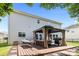 Spacious backyard deck with gazebo, outdoor seating, and hammock for relaxing on a sunny day at 10418 Cullen Ct, Charlotte, NC 28278