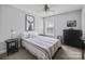 Bedroom featuring queen bed, with side tables, fan, and natural light at 10418 Cullen Ct, Charlotte, NC 28278