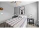 Bedroom featuring queen bed with side tables and fan at 10418 Cullen Ct, Charlotte, NC 28278