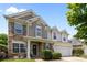 Charming two-story home featuring a two-car garage, stone accents, and manicured landscaping at 10418 Cullen Ct, Charlotte, NC 28278