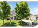 Beautiful two-story home with lush green lawn and mature trees, offering a serene and inviting curb appeal at 10418 Cullen Ct, Charlotte, NC 28278