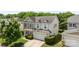 A two-story home showcases a well-maintained yard, inviting entrance, and a two car garage at 10418 Cullen Ct, Charlotte, NC 28278