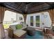 Inviting gazebo with comfortable wicker seating, a cozy rug, and views of the backyard, ideal for outdoor lounging at 10418 Cullen Ct, Charlotte, NC 28278