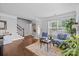 Comfortable living room with hardwood floors, neutral paint, and a staircase at 10418 Cullen Ct, Charlotte, NC 28278