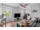 Living room features large tv, workspace, and a comfortable seating area at 10418 Cullen Ct, Charlotte, NC 28278