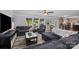 Spacious living room with hardwood floors, natural light, comfortable seating, and access to kitchen at 10418 Cullen Ct, Charlotte, NC 28278