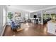 Open living room with hardwood floors, neutral paint, and plenty of natural light at 10418 Cullen Ct, Charlotte, NC 28278