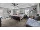 Spacious main bedroom with carpet, ceiling fan and tray ceiling at 10418 Cullen Ct, Charlotte, NC 28278