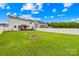 Overiew of the backyard with a fire pit and solar panels on the house at 115 Crownpiece St, Troutman, NC 28166