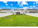 Expansive backyard with privacy fence, solar panels, and covered patio at 115 Crownpiece St, Troutman, NC 28166