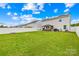 Spacious backyard with solar panels, privacy fence, and outdoor grill at 115 Crownpiece St, Troutman, NC 28166