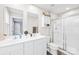 Bathroom featuring a double sink vanity, and a glass-enclosed shower stall at 115 Crownpiece St, Troutman, NC 28166