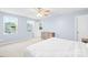 Bedroom with large windows offering bright natural light with a wooden dresser at 115 Crownpiece St, Troutman, NC 28166
